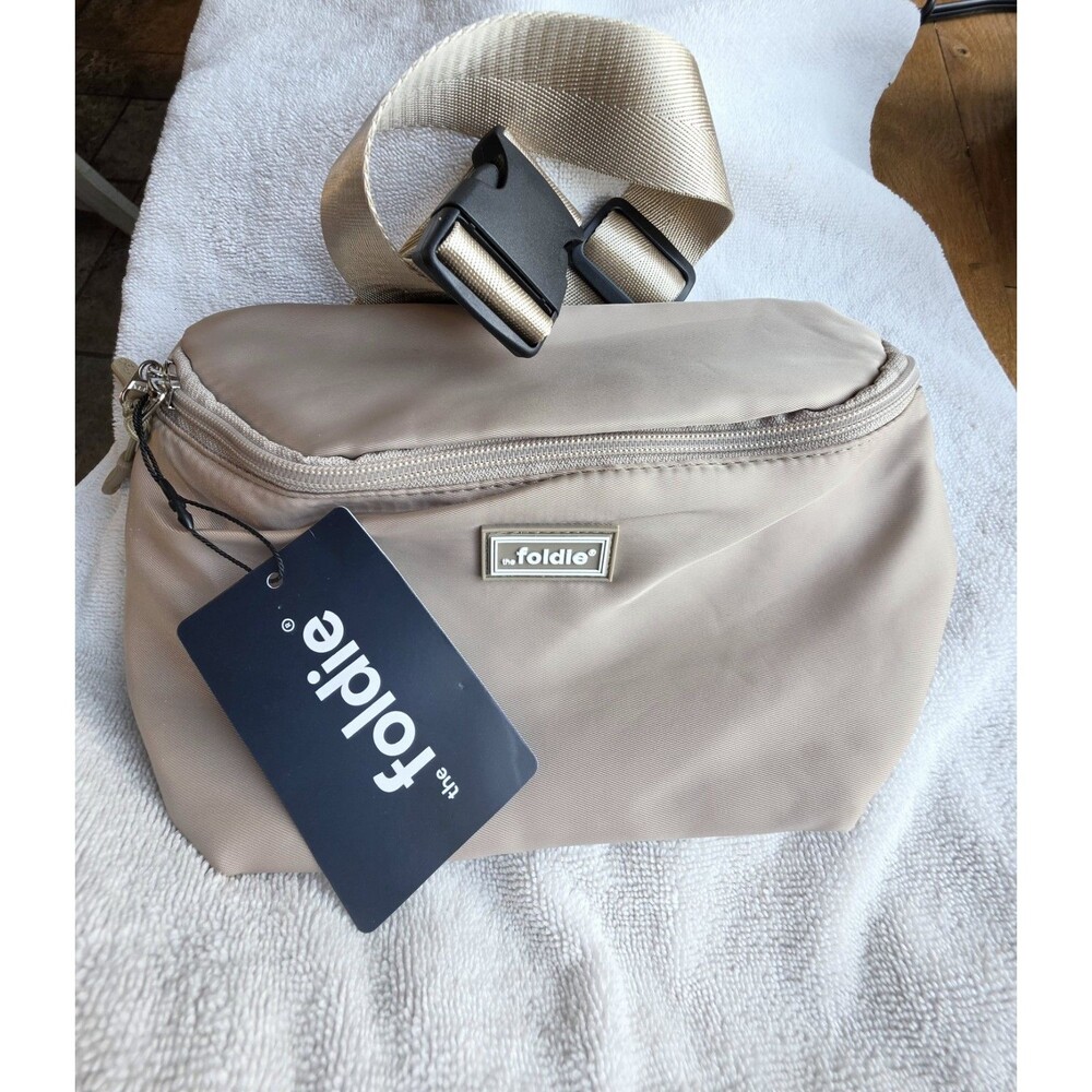The Foldie Crossbody Bag Beige Tan RFID Safe Anti Theft Travel Purse NWT